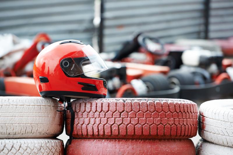 Helmet sitting on the side of the track of lakewood go kart racing