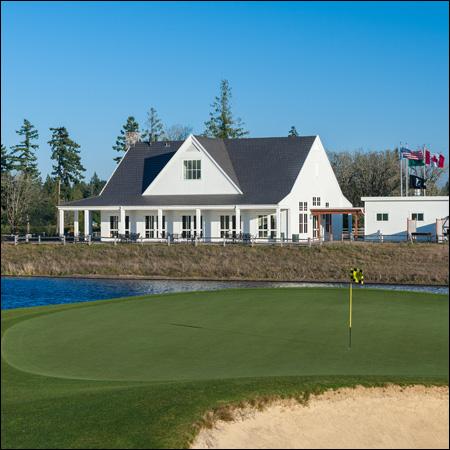 The golf shop on a sunny day next to a course water hazard