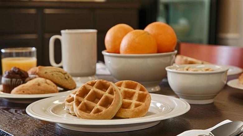 The continental breakfast with waffles and fresh fruit