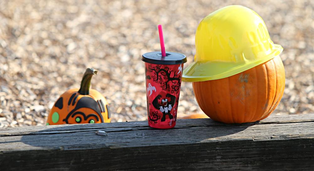 Photo of festive beverage next to a pumpkin at Truck and Tractor Day.